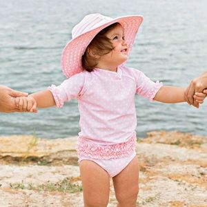 RuffleButts 3- Piece Pink Polka Dot Rashguard Swimsuit and Hat Set